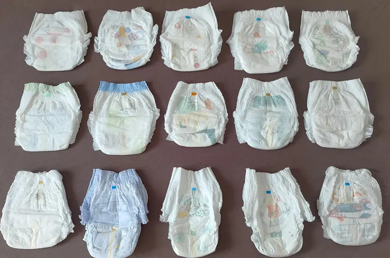 Assorted baby diaper styles laid out to show minor cosmetic differences