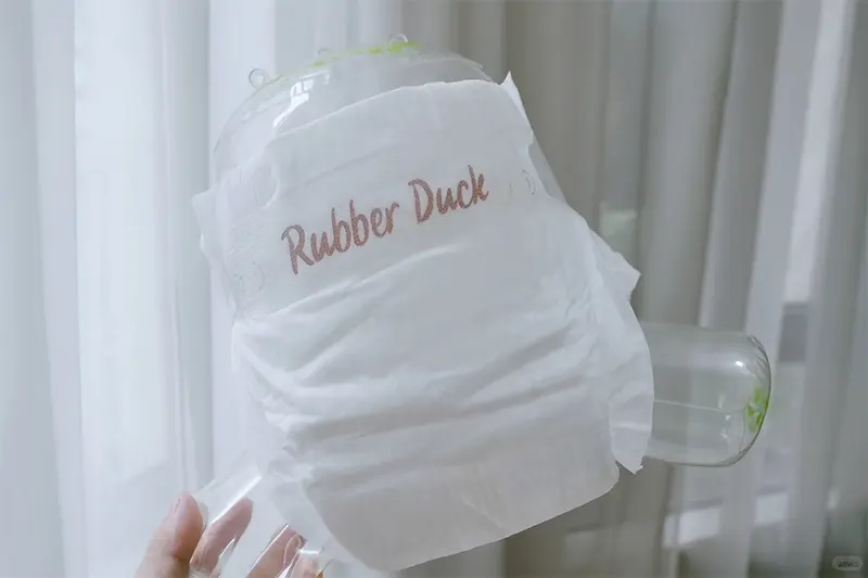 Elastic waistband shown on model diaper