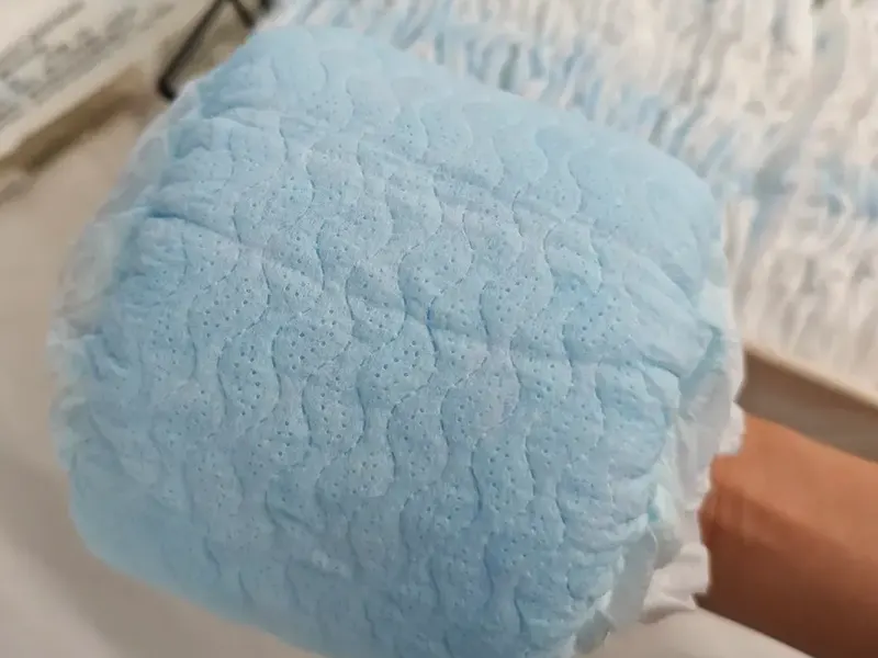 Saturated diaper core close-up showing even gel distribution and lock-in.