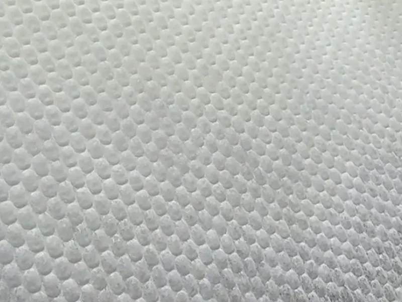 Close-up of large-pearl hot-air nonwoven topsheet texture