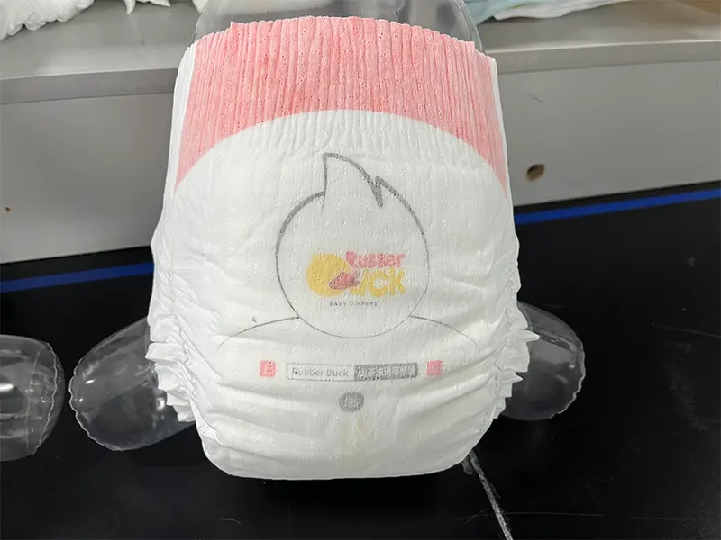 Rubber Duck baby diaper fitted on clear mannequin in lab