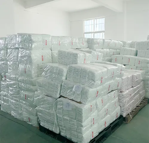 Pallets of bagged preemie diapers stacked in a warehouse