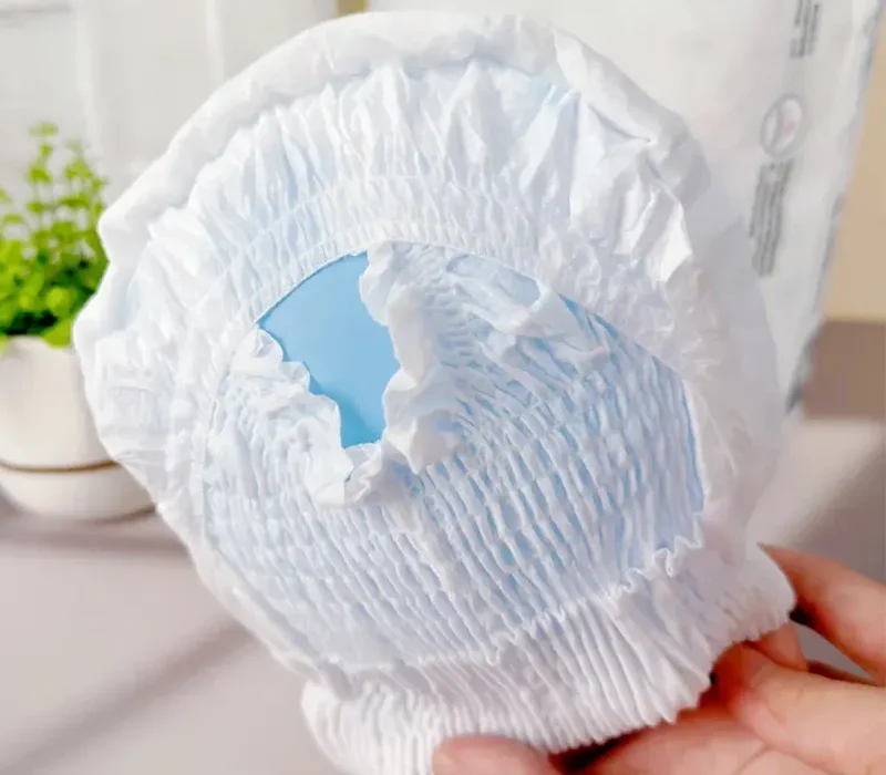 The side pictures of baby diapers show the leak guard design
